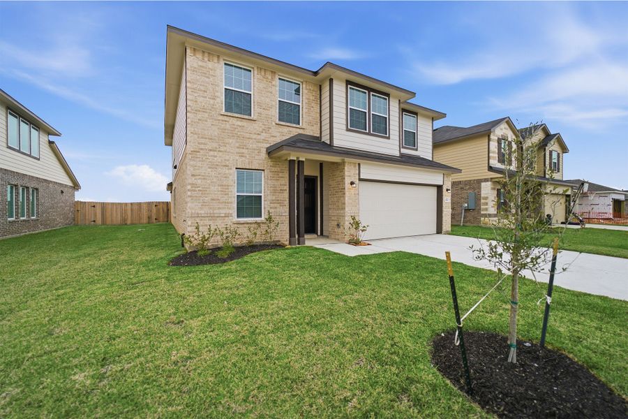 Front exterior of a new home in Pearlbrook, Texas City, TX, highlighting curb appeal (Image 19).