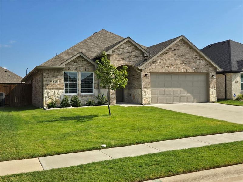 Front exterior of a new home in , Greenville, TX, highlighting curb appeal (Image 18). Front exterior of a new home in , Greenville, TX, highlighting curb appeal (Image 18).