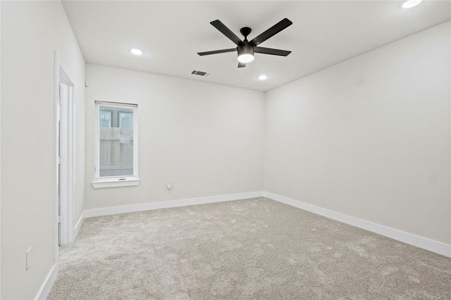 Unfurnished room with light colored carpet, ceiling fan, and recessed lighting