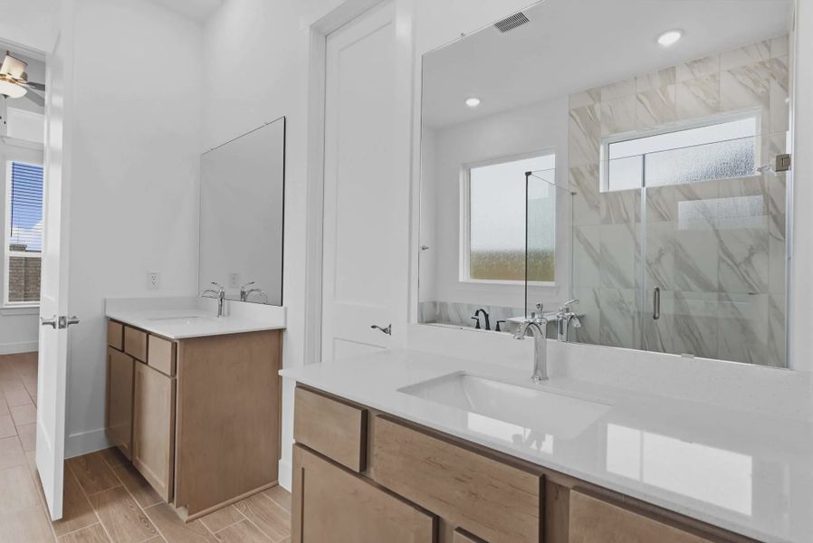 Representative furnished interior of a home built from the Summerton by Chesmar Homes in Beacon Point, Texas City (Image 13).