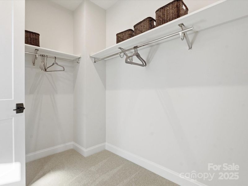 Primary Walk-In Closet. *Model Photos | Actual Finishes, Structural Selections, and Orientation May Vary. Primary Walk-In Closet. *Model Photos | Actual Finishes, Structural Selections, and Orientation May Vary.
