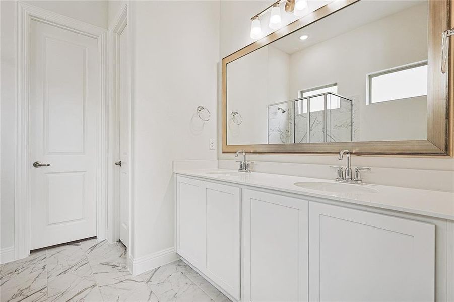 Bathroom with vanity and an enclosed shower