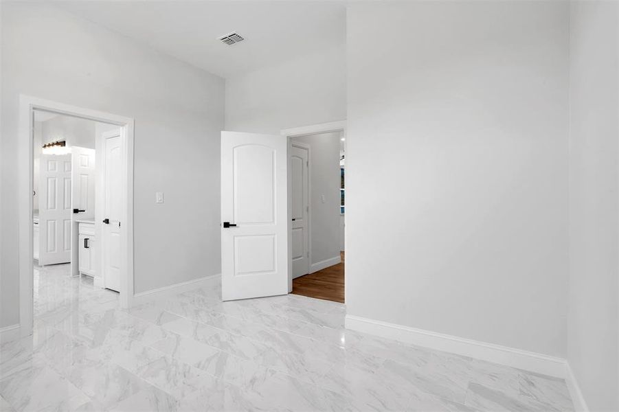 Spare room with light tile patterned floors