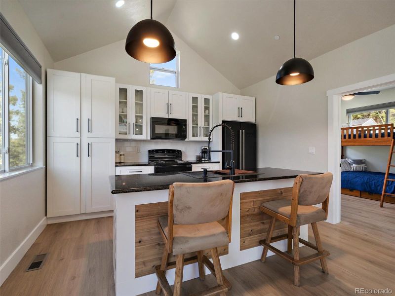 With wood accents and quartz countertops.