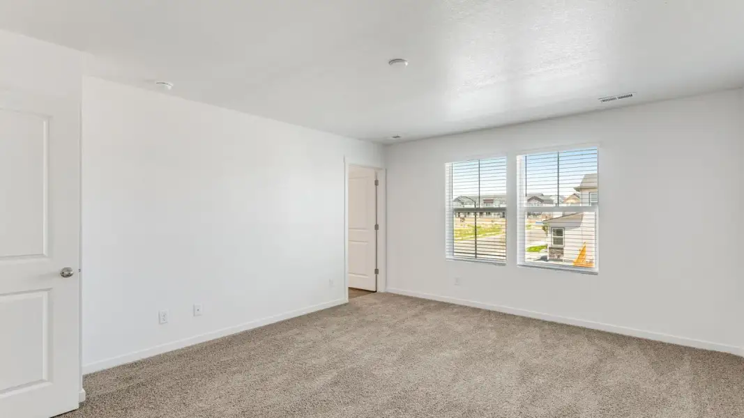 Spacious, unfurnished interior of a new home in Sky Ranch, Watkins (Image 16).