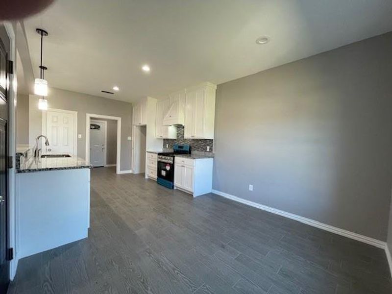 Kitchen facing utility room from dining area Kitchen facing utility room from dining area