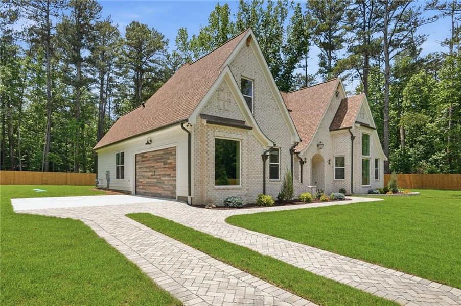 Front exterior of a new home in , Powder Springs, GA, highlighting curb appeal (Image 33). Front exterior of a new home in , Powder Springs, GA, highlighting curb appeal (Image 33).