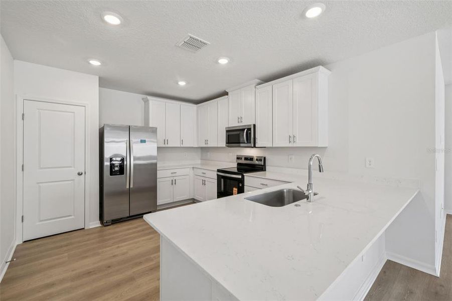 Furnished interior view inside a new home in Ridgehaven - Villas, Ormond Beach (Image 6).