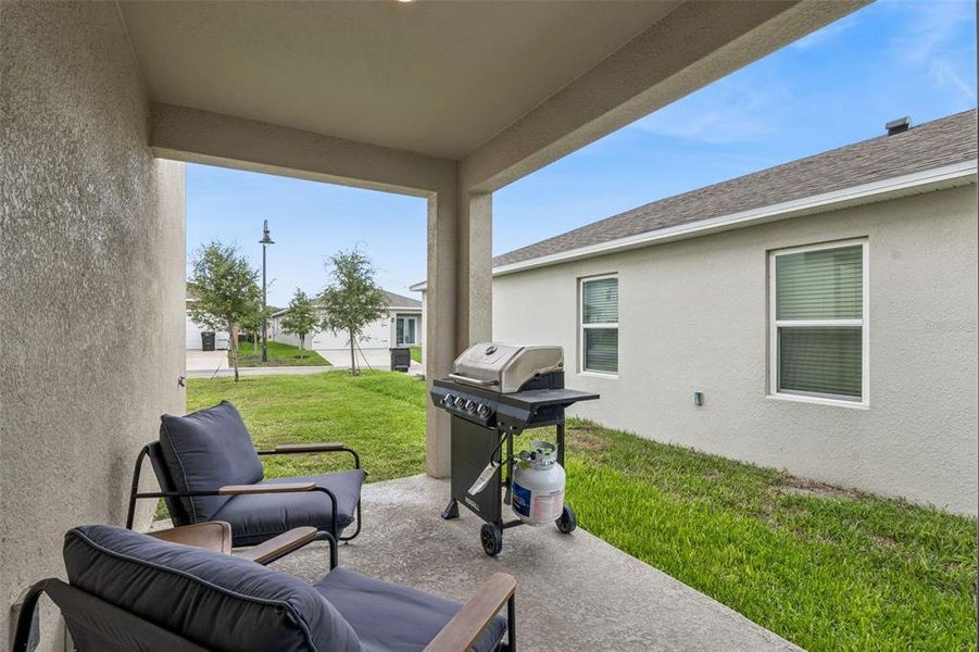 Exterior details and patio area of a home in Windrose, Apopka (Image 4).