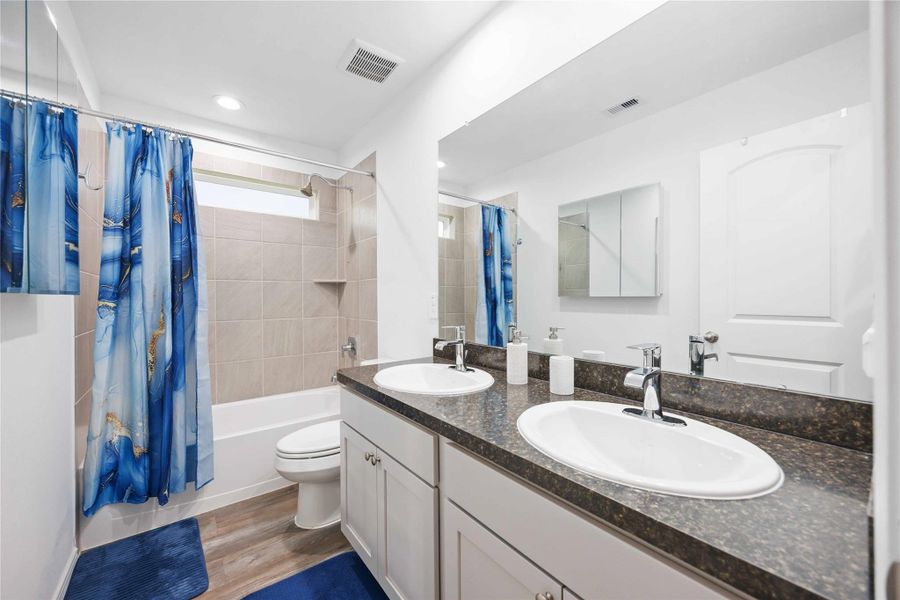Secondary Bath:Double sinks, tub/shower combo, and clean, modern finishes. Secondary Bath:Double sinks, tub/shower combo, and clean, modern finishes.