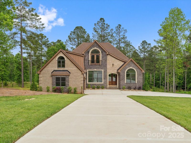 Front exterior of a new home in , Connelly Springs, NC, highlighting curb appeal (Image 24).