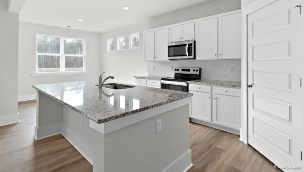Furnished interior view inside a new home in The Highlands at Cedar Hill Landing, Navassa (Image 5).