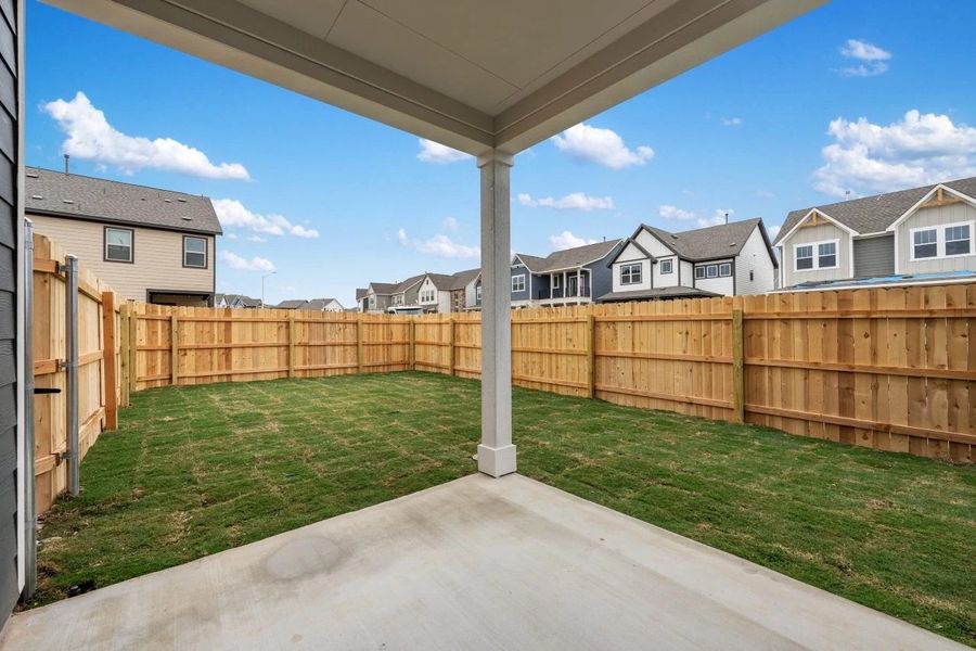 Exterior details and patio area of a home in The Cottages at Lariat, Liberty Hill (Image 27).