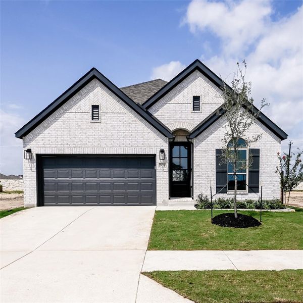 Front exterior of a new home in Juniper Springs, Lockhart, TX, highlighting curb appeal (Image 1). Front exterior of a new home in Juniper Springs, Lockhart, TX, highlighting curb appeal (Image 1).
