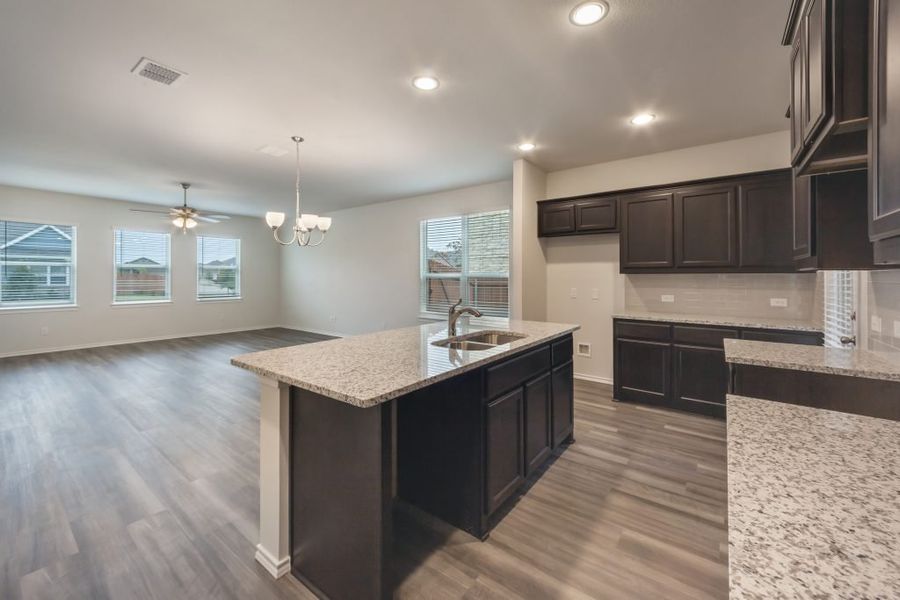 Representative exterior photo of a completed home built from the Harwood by Impression Homes in Heartland, Heartland, TX (Image 8).