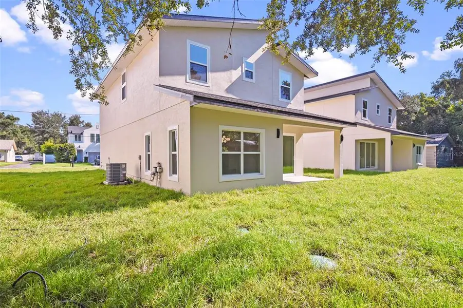 Front exterior of a new home in , Orlando, FL, highlighting curb appeal (Image 24).