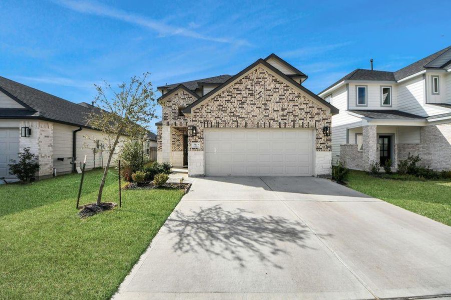 Front exterior of a new home in Winfield Lakes, Fresno, TX, highlighting curb appeal (Image 23).