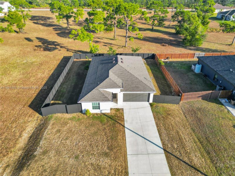 Front exterior of a new home in , Cape Coral, FL, highlighting curb appeal (Image 17). Front exterior of a new home in , Cape Coral, FL, highlighting curb appeal (Image 17).