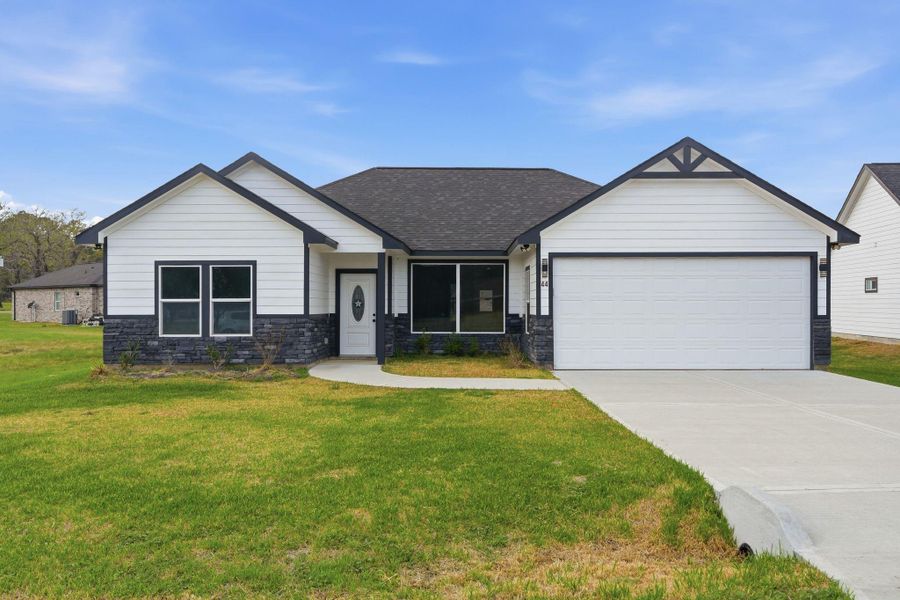 Front exterior of a new home in , Trinity, TX, highlighting curb appeal (Image 19).