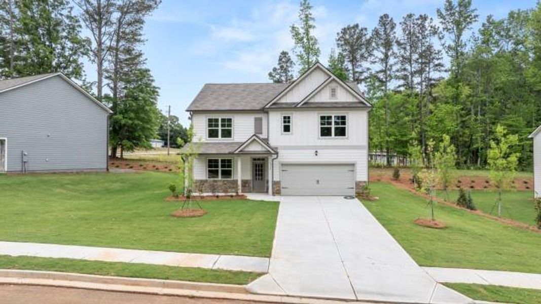 Front exterior of a new home in Creekview, Atlanta, GA, highlighting curb appeal (Image 2). Front exterior of a new home in Creekview, Atlanta, GA, highlighting curb appeal (Image 2).