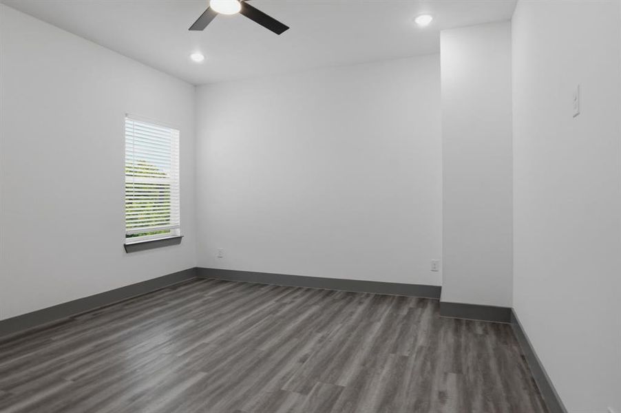 Interior room featuring wood-finish flooring, a window with blinds, a ceiling fan, and recessed lighting