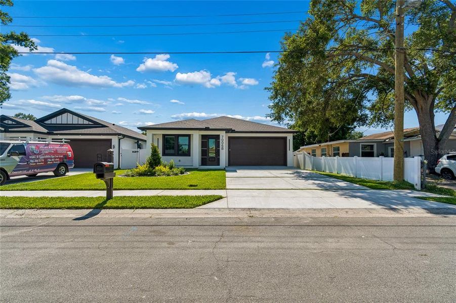Front exterior of a new home in , Tampa, FL, highlighting curb appeal (Image 27).