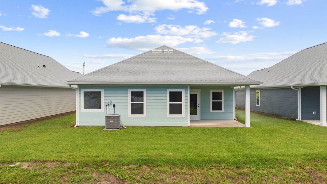 Exterior details and patio area of a home in Caballeros Estates At Hombre, Panama City Beach (Image 4).