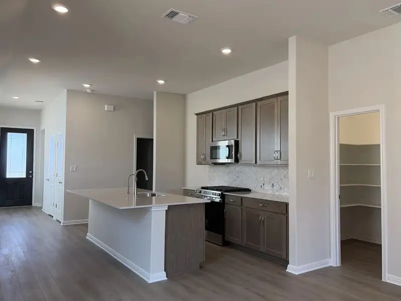 Furnished interior view inside a new home in La Cima, San Marcos (Image 3).