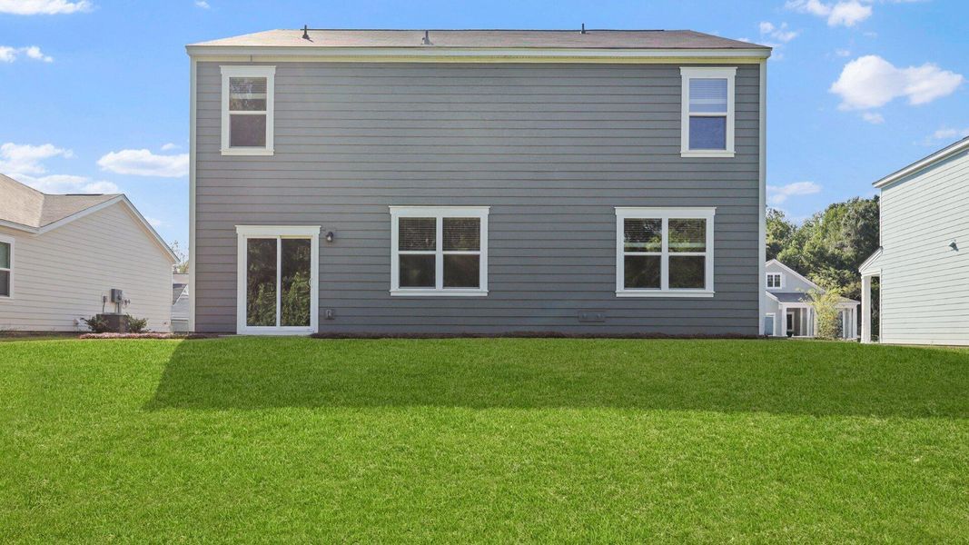 Front exterior of a new home in Lakeview at Kitfield, Moncks Corner, SC, highlighting curb appeal (Image 20). Front exterior of a new home in Lakeview at Kitfield, Moncks Corner, SC, highlighting curb appeal (Image 20).