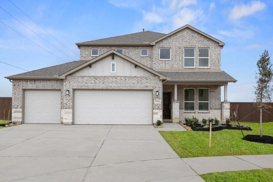 Front exterior of a new home in Creekhaven, Iowa Colony, TX, highlighting curb appeal (Image 17).