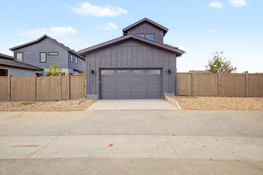 Front exterior of a new home in West Grange, Longmont, CO, highlighting curb appeal (Image 16). Front exterior of a new home in West Grange, Longmont, CO, highlighting curb appeal (Image 16).