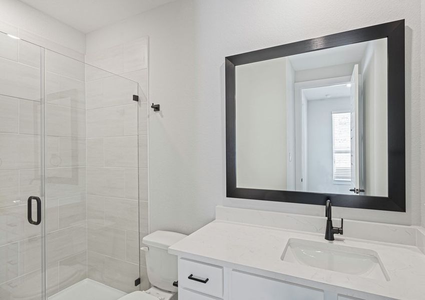 The third full bathroom has a vanity and glass, walk-in shower. The third full bathroom has a vanity and glass, walk-in shower.