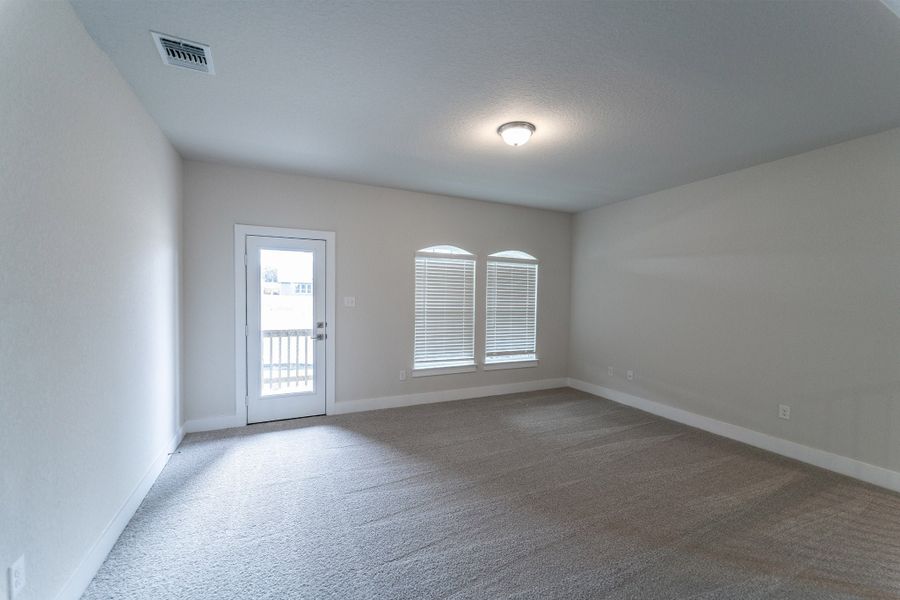 Spacious, unfurnished interior of a new home in The Woodlands at Medina Hills, Mico (Image 14).