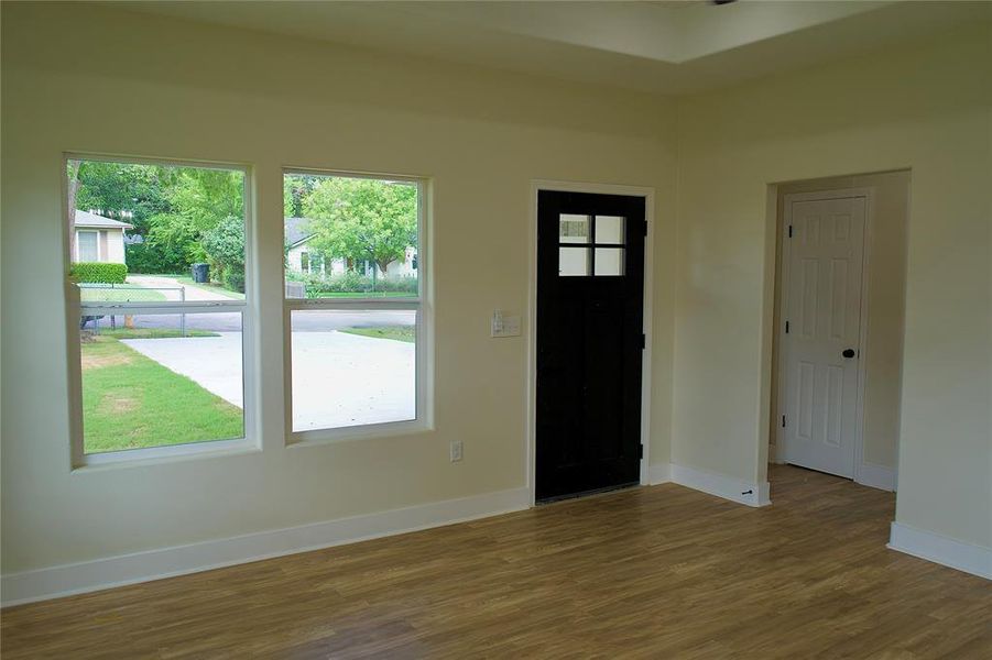 Foyer entrance with wood finished floors