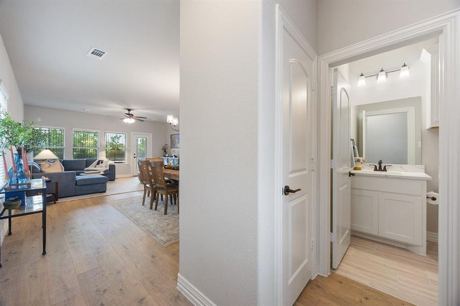 Corridor featuring light wood-style flooring