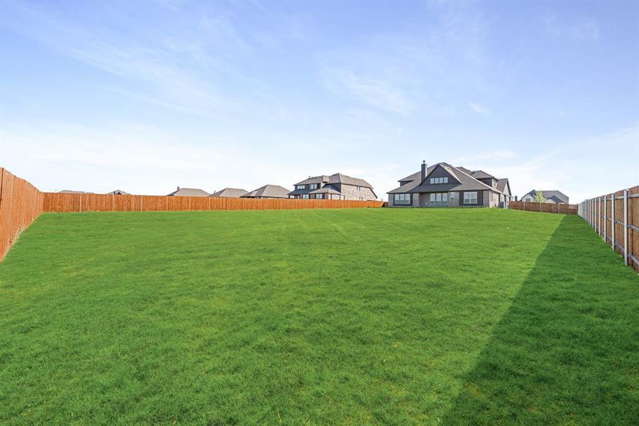 Exterior details and patio area of a home in Coyote Crossing, Godley (Image 26).