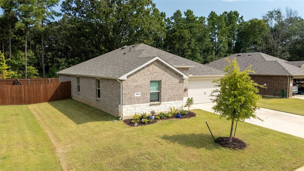 Front exterior of a new home in , Chandler, TX, highlighting curb appeal (Image 20). Front exterior of a new home in , Chandler, TX, highlighting curb appeal (Image 20).
