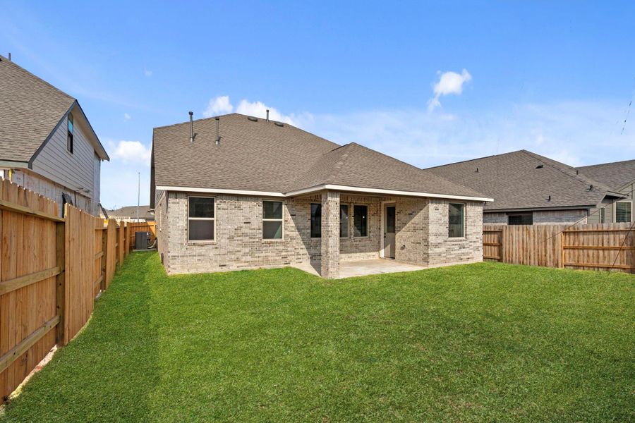 Exterior details and patio area of a home in The Meadows at Imperial Oaks, Conroe (Image 3).