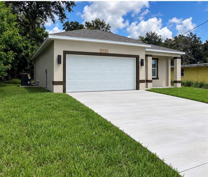 Front exterior of a new home in , Auburndale, FL, highlighting curb appeal (Image 22).