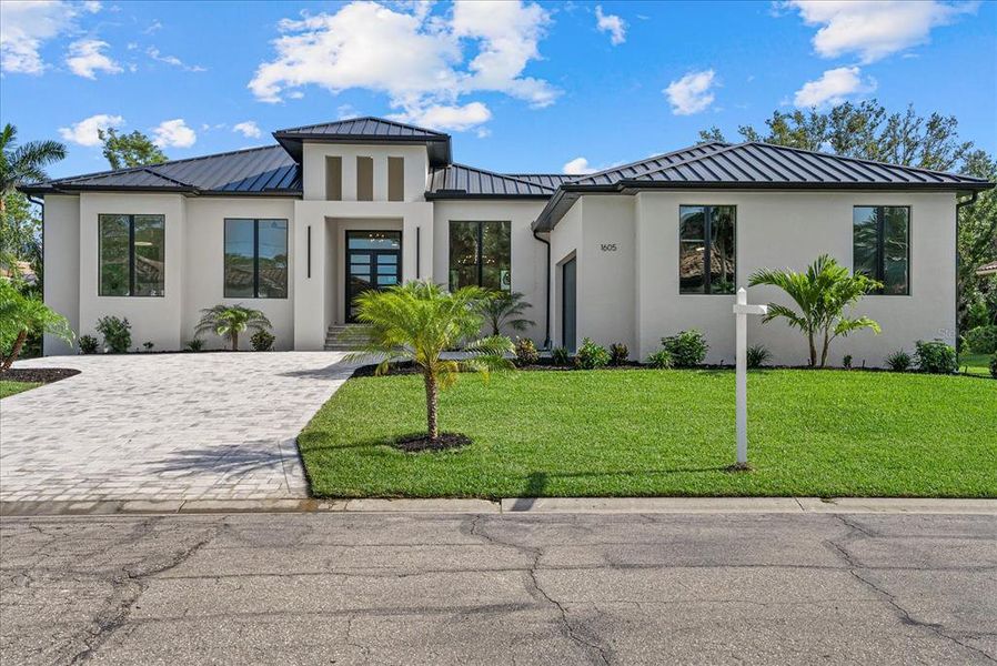 Front exterior of a new home in , Nokomis, FL, highlighting curb appeal (Image 24).