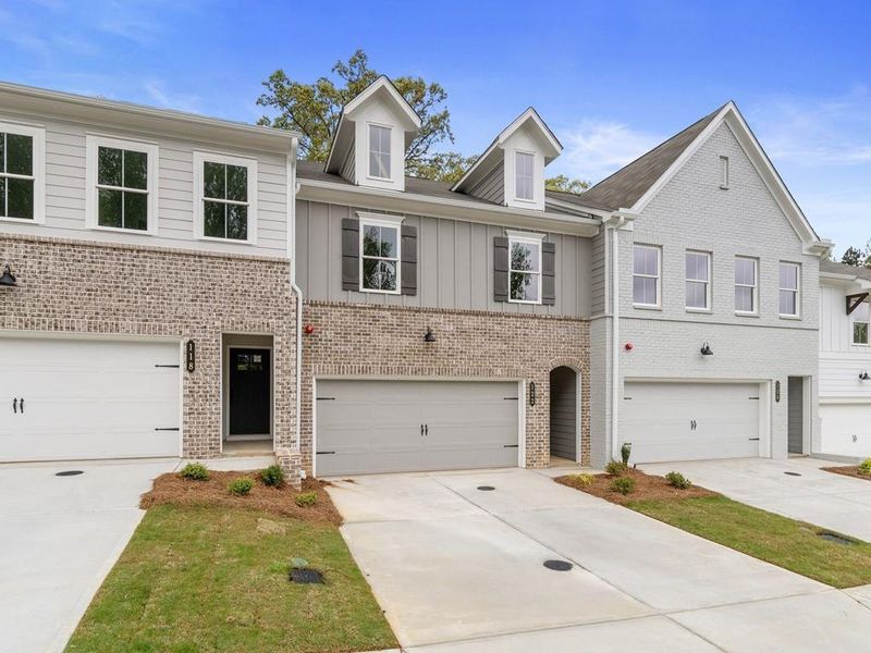 Front exterior of a new home in River Walk Place, Lawrenceville, GA, highlighting curb appeal (Image 17).