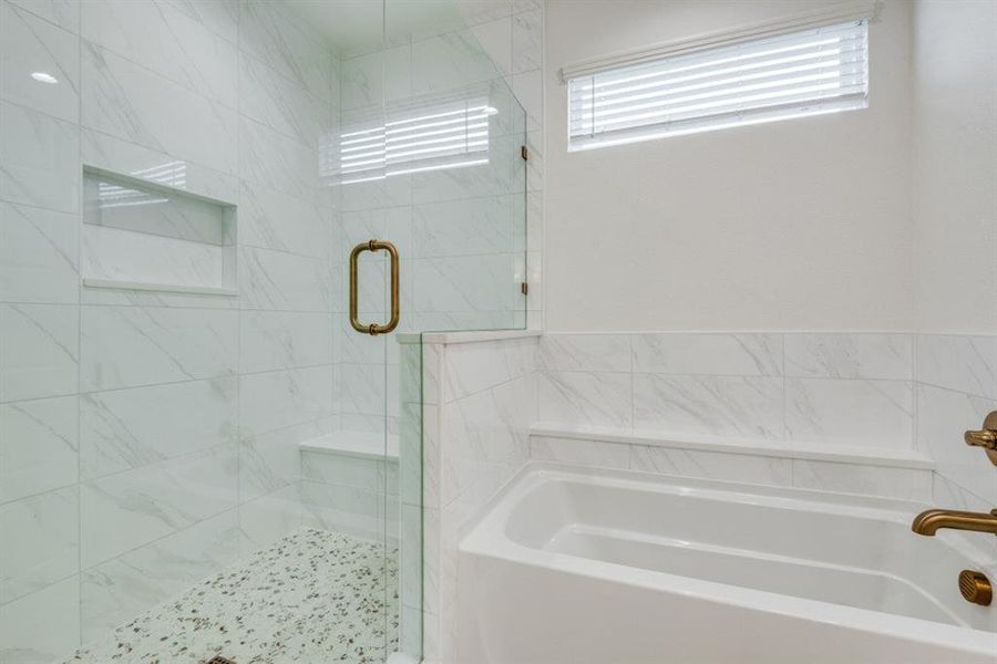 Bathroom featuring separate shower and tub