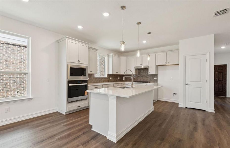 Kitchen featuring a large island ideal for informal dining and gatherings *Real home pictured Kitchen featuring a large island ideal for informal dining and gatherings *Real home pictured