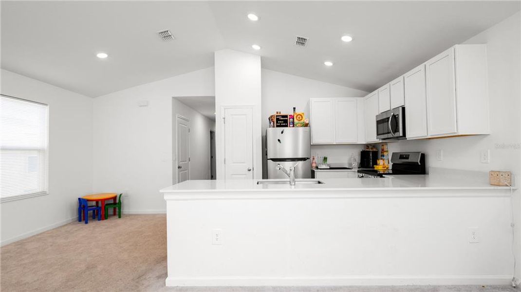 Furnished interior view inside a new home in Peace Creek Reserve: Legacy Collection, Winter Haven (Image 12).