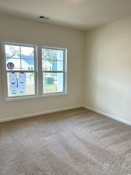 Unfurnished room featuring carpet and baseboards