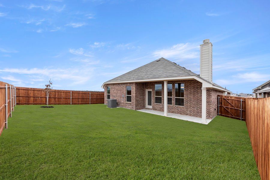 Representative exterior photo of a completed home built from the Kingston by Impression Homes in Timberbrook, Justin, TX (Image 27).