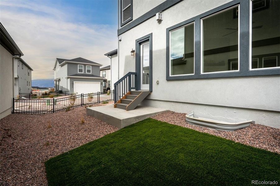 Exterior details and patio area of a home in Revel Crossing at Wolf Ranch – The Outlook Collection, Colorado Springs (Image 3).