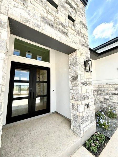 Elegant stone masonry and an inviting entry welcome you to this distinguished residence. Elegant stone masonry and an inviting entry welcome you to this distinguished residence.
