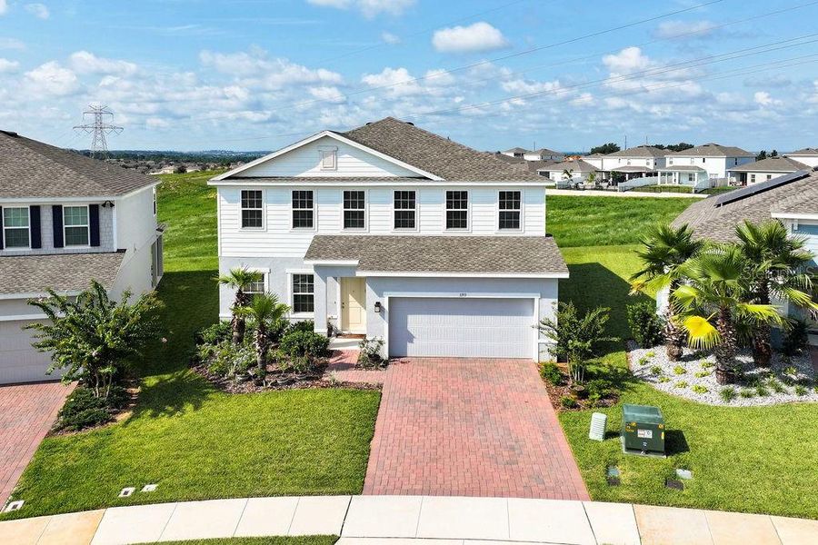 Front exterior of a new home in , Minneola, FL, highlighting curb appeal (Image 25). Front exterior of a new home in , Minneola, FL, highlighting curb appeal (Image 25).