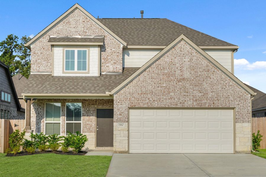 Front exterior of a new home in Barton Creek Ranch, Conroe, TX, highlighting curb appeal (Image 16).